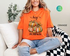 Celebrate autumn with our Hey Pumpkin Shirt, perfect for visiting the pumpkin patch or cozy fall days. This retro-inspired women's crewneck makes a cute and thoughtful gift for her, bringing festive charm to any autumn outfit. It is perfect for everyday wear, travel and casual occasions. Handmade in the United States, this shirt is an ideal choice for any season, be it winter, summer, fall, or spring. Size up 2 sizes for an oversized look and feel. How To Order 1) Please review all of the photos Trendy Comfortable Fit T-shirt For Fall, Trendy Comfort Fit T-shirt For Fall, Orange Crew Neck T-shirt For Fall, Comfortable Fit T-shirt For Fall, Patch T Shirt, Autumn Shirts, Fall Pumpkin Patch, Hey Pumpkin, Cute Fall Shirt