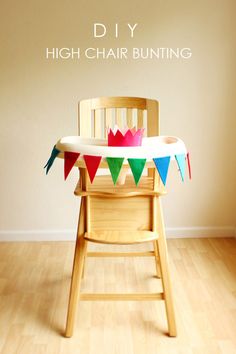 a wooden chair sitting on top of a hard wood floor next to a white wall