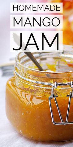 homemade mango jam in a glass jar with a spoon on the side and text overlay that reads homemade mango jam