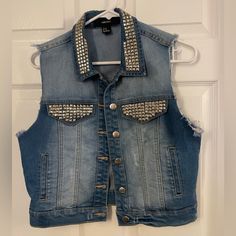 Nwot Denim Studded Vest.Size Medium. Trendy Fitted Denim Vest For Streetwear, Trendy Distressed Denim Vest For Winter, Trendy Fall Denim Vest For Streetwear, Trendy Fall Streetwear Denim Vest, Edgy Summer Denim Outerwear, Fitted Distressed Denim Vest For Winter, Fitted Denim Vest For Winter Streetwear, Trendy Dark Wash Denim Vest For Streetwear, Fitted Denim Vest For Spring Streetwear