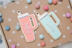 two handmade tags with the words happy mother and baby on them next to some candy