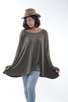 "WhatWouldSusieWear's Khaki Green Soft Flared Bottom FRENCHIE Top with Long Sleeves and Thumbholes. Made of soft and delicious Rayon Spandex. Full swing bottom is a bit shorter in the front than the sides and back, and super flattering for all body types. Great with Jeans, Shorts, Skirts and so comfy you'll wanna sleep in it! Great to throw in your bag when for the evening, or just when you need something light, yummy and fashionable to throw over you at the Beach or dinner. Join the Frenchie Br Olive Stretch Tops For Fall, Top With Long Sleeves, Flare Top, Green Soft, Shorts Skirts, Palm Beach Fl, Top Sweater, West Palm Beach, West Palm