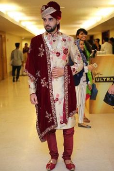 burdundy with white embroidery safa and stole   for the Indian groom. Copy link to your browser YouTube channel Zorah Int Website https://zorahinternational.com/ Blog https://priyabinzorah.blogspot.com Facebook https://www.facebook.com/Zorah-International-106810155016614 Cream Fitted Sherwani For Semi-formal Occasions, Formal Fitted Suit With Traditional Drape, Semi-formal Fitted Cream Sherwani, Elegant Beige Unstitched Suit For Formal Occasions, Elegant Cream Sherwani For Semi-formal Occasions, Beige Traditional Drape Sets For Formal Occasions, Elegant Long Beige Sets, Elegant Fitted Suit With Traditional Drape, Elegant Beige Fitted Sherwani