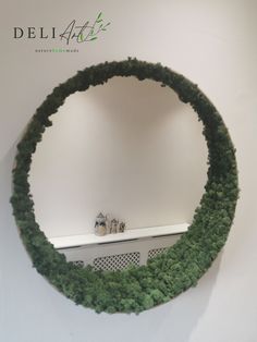 there is a circular mirror made out of plants