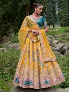 Buy enthralling yellow silk embroidered lehenga choli | inddus.com. Checkout this outstanding lehenga online at the best price in India with express free shipping worldwide. Chaniya Choli For Navratri, Women Lehenga Choli, Choli For Navratri, India Outfits, Dupatta Painting, Lehenga Online Shopping, Women Lehenga, Bridal Lehenga Online, Designer Bridal Lehenga Choli