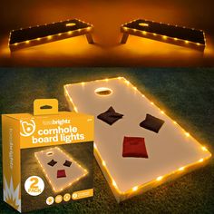 two light up cornhole boards with lights on them