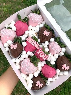 a box filled with chocolate covered strawberries and marshmallows that spell out i love you