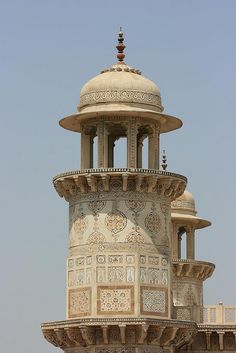 an ornate building with a clock on the top