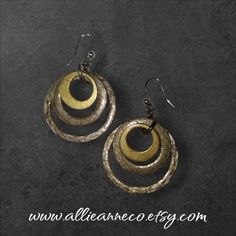 Hammered Hoop Shape Earrings.  I sell only vintage or pre-owned jewelry and I use my pictures as part of the description. As with most vintage items there may be wear consistent with the age.  Find more unique vintage earrings and jewelry in my store at AllieAnneCo.etsy.com Thank you for stopping by! 😊 https://www.etsy.com/shop/AllieAnneCo Vintage Brass Hoop Earrings For Gifts, Vintage Bronze Earrings With Oxidized Finish, Bronze Vintage Earrings With Oxidized Finish, Handmade Metal Retro Earrings, Handmade Retro Metal Earrings, Vintage Brass Hoop Earrings, Vintage Brass Round Hoop Earrings, Bronze Small Hoop Metal Earrings, Vintage Bronze Hoop Earrings