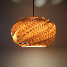 a wooden light fixture hanging from a ceiling