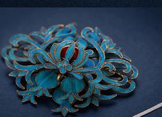 The unique craftsmanship of this retro palace style fine jewelry is handcrafted with beautiful agate stone in the color of turquoise and beautifully entwined adding to the elegant look. This classic style brooch is the perfect gift for Mother's Day, anniversary, bridal party, engagement, wedding, or the holiday season. Turquoise Brooch For Formal Occasions, Handmade Blue Wedding Brooches, Formal Blue Handmade Brooches, Ornate Blue Brooches For Wedding, Elegant Blue Brooch For Gift, Elegant Blue Brooch Gift, Ornate Blue Wedding Brooches, Elegant Blue Wedding Brooches, Unique Handmade Turquoise Brooch