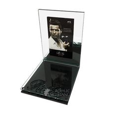 an acrylic display case with a man's face on the front and side