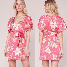 Brand New Without Tags. The Trending Tropic Dress Is A Tropical Floral Print Reverse Crepon Wrap Front Dress With A Flattering Deep V-Neckline, Flutter Sleeves, And A Tie Waist Belt. Sold At Revolve, Lulus, And Nordstrom. Color: Hot Pink/Various Measurements: Bust 34” Waist 26” Length 38” U19 Wrap Front Dress, Tropical Floral Print, Bb Dakota, Tropical Floral, Flutter Sleeves, Waist Belt, Ruffle Dress, Flutter Sleeve, Hot Pink