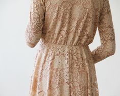 "Stunning. trending and lightweight short lace dress. Lace bodice and long sleeves, at knee length. This is the perfect lace dress for any special occasion or party or for stylish bridesmaids on a summer wedding! The dress has a modest yet vintage style, knee-length hemline, delicate v-neck, and is carefully crafted using the finest soft lace. A refined and classic fit designed for style, comfort, and form. The lace dress is graceful and a timeless gown. ♥ Wrap top with V-neckline ♥ Long lace sl Long Sleeve Delicate Lace Party Dress, Fitted Long Sleeve Lace Dress With Lace Back, Long Sleeve Beige Lace Dress With Patchwork, Beige Long Sleeve Lace Dress With Patchwork, Spring Bridesmaid Lace Dress With Lace Back, Spring Dresses With Delicate Lace And Long Sleeves, Long Sleeve Delicate Lace Dress For Formal Occasions, Long Sleeve Lace Dress With Lace Back For Party, Long Sleeve Lace Back Party Dress