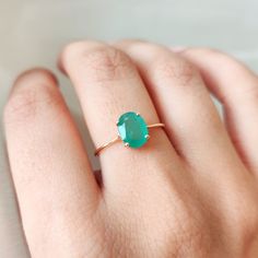 This stunning ring is set in 14k Solid Yellow Gold with Natural Emerald with utmost precision. It is an unique dainty gemstone ring for nearly every occasion and is completely hassle-free jewelry. 🔷GEMSTONE:  Emerald is often associated with love and romantic relationships. It is believed to promote love, loyalty, and unity, making it a popular choice for engagement and anniversary jewelry. Emerald is often associated with abundance and financial success. It is believed to attract prosperity an Elegant Oval Solitaire Gemstone, Emerald Oval Cabochon Ring As A Gift, May Birthstone Rings In Oval Cabochon Shape, May Birthstone Oval Cabochon Rings For Gift, 14k Gold Oval Cabochon Emerald Ring Gift, Oval Emerald Gemstone Ring Fine Jewelry, Solitaire Oval Cabochon Jewelry As Gift, Oval Emerald Ring Gift, Emerald Oval Cabochon Ring Gift