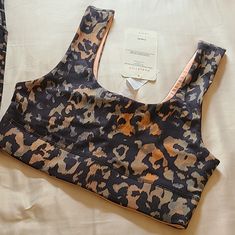 Fabletics Reversible Midi Sports Bra Is New With Tags. Abstract Animal Print On One Side And The Other Peach Making This A Versatile Sports Bra. Size Small/6 Orange Athleisure Sports Bra With Stretch, Orange Seamless Activewear For Gym, Orange Athleisure Sports Bra For Workout, Orange Athleisure Sports Bra For Yoga, Orange Medium Support Sports Bra For Workout, Seamless Orange Sports Bra For Gym, Orange Seamless Sports Bra For Workout, Orange Seamless Gym Activewear, Orange Athleisure Stretch Sports Bra