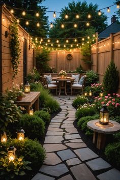 an outdoor patio with lights strung over the table and chairs, surrounded by greenery