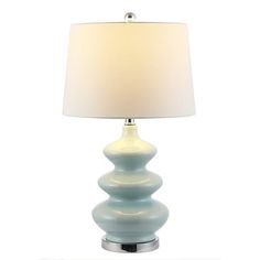 a lamp that is sitting on top of a table in front of a white background