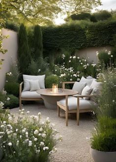 an outdoor seating area with white flowers and greenery