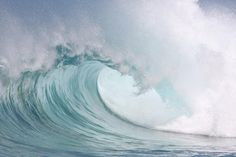 a large wave is breaking in the ocean