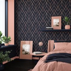 a bed room with a neatly made bed next to a wall mounted shelf and potted plants