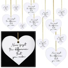 a set of twelve heart shaped ornaments with handwritten words on the front and back