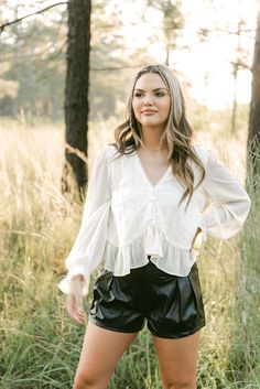 Indulge in effortless elegance with our Cream Embroidered Long Sleeve Blouse. The cream hue and delicate embroidery exude sophistication, while the light weight and flowy fit provide comfort and ease. With a v-neckline, ruffle hem, and button up style, this blouse is the perfect addition to your wardrobe. runs true to size little to no stretch 100% POLYESTER model, Brooke is wearing a size medium Sneaker Heels Wedges, Boutique Trends, Delicate Embroidery, Auburn University, Long Crop Top, Effortless Elegance, The Cream, Leather Shorts, Romper Dress