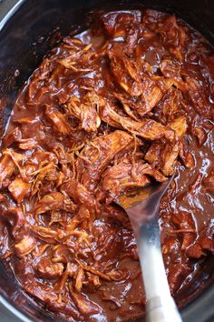 the best bbq pulled chicken recipe in a slow cooker is ready to be eaten