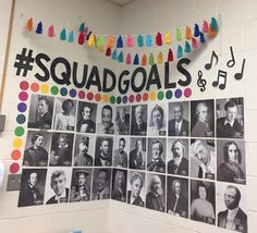 a classroom wall decorated with many different colored photos and the words squad goals on it