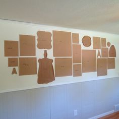 several pieces of cardboard are arranged on the wall