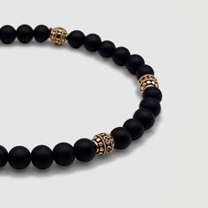 Effortless style is good manners. CRAFTD for individuality, every semi-precious Onyx stone displays its own unique markings, resulting in a truly one-of-a-kind piece. Enhanced with 18K gold beads, its relaxed aesthetic becomes the ideal companion for those essential laid-back days. Qualities: Sharpened Focus ✓ Semi-Precious Onyx Stone✓ 18K Gold & 316L Stainless Steel ✓ Water, Heat, Sweat Resistant Model is 5'11 & Wears Size 19cm. Modern Hand-strung Jewelry For Gifts, Onyx Bracelets With Natural Stones As Gifts, Onyx Bracelets With Natural Stones For Gift, Modern Polished Beads Bracelet, Elegant Gemstone Beads Crystal Bangle Bracelet, Elegant Crystal Gemstone Beads Bangle Bracelet, Spiritual Onyx Beads Jewelry 8mm, Elegant Crystal Bangle Bracelet With Gemstone Beads, Modern Bracelets With Natural Stones