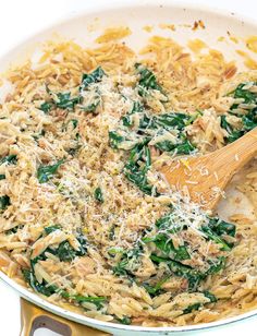 pasta with spinach and parmesan cheese in a skillet