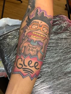 a person with a tattoo on their arm that says clee and has an image of a man's face