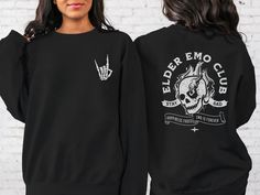 "*This shirt has a design on the FRONT & BACK* The Elder Emo Club T-shirt is the perfect Pop Punk Shirt for anyone who loves emo music and culture. With a striking skull design, this Emo Concert Shirt is the perfect way to show off your love for the genre. This Shirt for Elder Emo proudly displays the \"Emo Forever\" and \"It Was Never A Phase\" slogans, making it clear that your love for emo is here to stay. The Stay Sad Club Shirt is made with high-quality materials, ensuring both comfort and durability. Whether you're heading to a concert or just want to show off your love for emo, the Elder Emo T-shirt is a must-have. Get your hands on this stylish and versatile Emo Concert Shirt today and join the club! Ideal for any situation, a unisex heavy blend crewneck sweatshirt is pure comfort. Casual Concert Tops With Front And Back Print, Casual Tops With Front And Back Print For Concert, Emo Crew Neck Top For Fan Merchandise, Punk Summer Outfits, Emo Concert, Emo Party, Punk Summer, Elder Emo, Punk Shirt