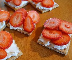 strawberries are arranged on top of crackers to look like they have whipped cream