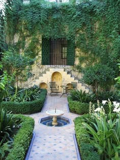 an outdoor courtyard with lots of greenery