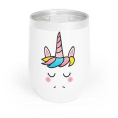 a white cup with a unicorn face painted on it