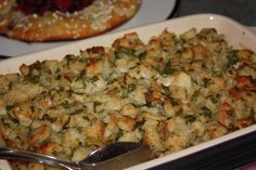 a casserole dish filled with stuffing and vegetables