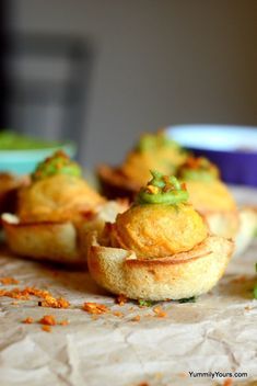 small appetizers are sitting on the table ready to be eaten