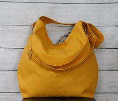 Here it is -- your basic everyday bag in a choice of 16 colors! This large slouchy hobo crossbody bag has a duck canvas exterior and a cotton interior. This bag is lightweight, versatile and durable. It would make a great bag for women of all ages too. Use this bag for school, work, travel, shopping or at the gym -- there's plenty of room for everything you need to carry! This canvas crossbody has a detachable adjustable strap, two large slip in and a zipper pocket on the inside, a magnetic snap Spring Hobo Bag For Everyday Use, Hobo Crossbody Bag, Good Birthday Presents, Duck Canvas, Everyday Bag, Rebecca Minkoff Hobo, Army Green, Zipper Pocket, Color Choices