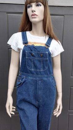 Cute pair of Vintage 70's Van Cort blue  denim Overalls.  So Cool looking.   Nicely broken in with light fading spots as shown. on the back lower leg are some small frayed holes.  They have adjustable shoulder straps and  a zipper  fly.  Measurements are taken with item laying flat so widths across must be doubled  Length = 51 1/2 in   in (measured without the straps, from the top of bib down to leg hems) Across the Waist = 15 in Across the Hips =  18 1/2   in Across Leg Opening =9   in Inseam = Retro Cutoff Medium Wash Jeans, Vintage Cotton Medium Wash Shortalls, Retro Dark Wash Cotton Shortalls, Retro Cotton Dark Wash Shortalls, High Rise Medium Wash Cotton Shortalls, Retro Medium Wash Cutoff Jeans, Vintage Denim Blue Cotton Shortalls, Vintage Denim Shortalls In Medium Wash, Vintage Medium Wash Denim Shortalls