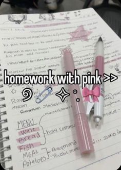 two pens sitting next to each other on top of a notebook with the words homework with pink