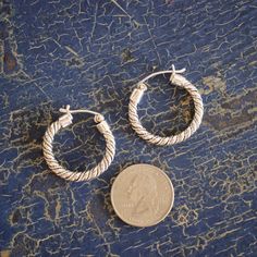 Very pretty, heavy, twisted sterling silver hoop earrings with a nice self-locking clasp behind the ear were handmade in Taxco, Guerrero, the silver mining capital of Mexico. They are .925 sterling silver. Updated traditional hoops that are exceptionally well made. Classic hoop earrings! state of origin: Taxco, Guerrero dimensions: about 1" long, 1' wide Mexican Silver Jewelry, Mexican Earrings, Mexico Style, Mexican Jewelry, Updated Traditional, Sterling Silver Hoop Earrings, Mexican Art, Mexican Folk Art, Sterling Silver Hoops