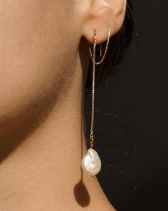 Product Details Gemstone: Baroque Pearl Drop Length: 2 inches on both sides Metal:14k Gold PVD Stainless steel and Stainless Steel Safe for sensitive skin Handcrafted in the USA