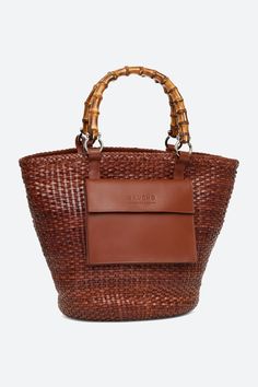 Maria Woven Leather Basket Bag in Cognac Cognac Woven Leather Bag For Everyday Use, Everyday Cognac Woven Leather Bag, Daily Use Cognac Woven Leather Bag, Brown Woven Leather Bucket Bag For Shopping, Brown Woven Leather Shopping Bucket Bag, Brown Leather Shoulder Bag With Bamboo Handle, Luxury Brown Bag With Bamboo Handle, Luxury Brown Bags With Bamboo Handle, Modern Brown Woven Leather Shoulder Bag