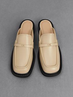 Look sophisticated without the fuss with these leather mules. The classic loafer style has been adapted into a wearable, slip-on design that offers comfort with a polished appearance. In versatile beige, it will match well with most outfits. Elevated by low block heels, they will elongate your frame without compromising walkability. Wear them with a plain t-shirt and jeans for an effortless, casual-chic look. Look Sophisticated, Loafer Style, Plain T Shirt, Size Chart For Kids, Loafers Style, Loafer Mules, Charles Keith, Low Block Heels, T Shirt And Jeans