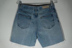 Here's a great pair of blue cotton denim jean, quality cut off shorts by the high end Bill Blass vintage collector's label. You will love knocking about in these well worn in cut jeans summer shorts! They are great for all outdoors activities and have a very vintage look and eye-catching appeal with their as found vintage character: There's a distressed character hole near the zipper (see last picture) and discoloration (see second to last picture) that add to this pair of jeans shorts cutoffs v Light Wash Cotton Jean Shorts With Belt Loops, Distressed Cotton Straight Leg Jean Shorts, Distressed Cotton Jean Shorts With Straight Leg, Medium Wash Cotton Jean Shorts With Belt Loops, Distressed Cotton Mid-rise Jean Shorts, Distressed Mid-rise Cotton Jean Shorts, Fitted Light Wash Cotton Jean Shorts, Fitted Washed Jean Shorts, Fitted Washed Cotton Jean Shorts