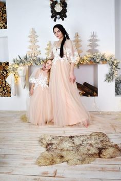 Very beautiful beige mother daughter matching lace maxi dresses for unforgettable moments!We are glad to welcome you in our atelier! We offer a complete set of matching dresses for a mother and daughter. All of the dresses in our shop are made based on your individual measurements. It is personally sewn by our seamstress on professional and modern equipment. We guarantee very high quality of sewing. We take into account all of your wishes when we craft our designs. They will fit and look much be Lace Maxi Dresses, Victorian Outfits, Most Expensive Dress, Mother Daughter Dresses Matching, Daughter Dress, Dress Minimal, Mommy And Daughter, First Birthday Dresses, Mother Daughter Dress