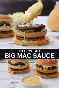 the big mac sauce is being drizzled on hamburgers