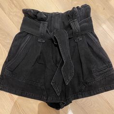 Brand New With Tags Never Worn. Black Denim Paper Back Shorts With Zipper Fly & Tie Closure. Front And Back Pockets. High Waisted. Chic Washed Black Bottoms For Work, Chic Washed Black Bottoms With Pockets, Chic Washed Black Cotton Bottoms, Chic Short Jeans With Belt Loops, Chic Black Jeans With Belt Loops, Black Short Jeans With Belt Loops, Chic High Waist Washed Black Bottoms, Chic Black Short Jeans, Chic Short Black Jeans